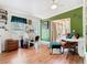 Inviting open concept living area with laminate wood floors and access to the sunroom at 5852 Medinah Way, Orlando, FL 32819