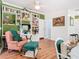 Comfortable living area with custom-built bookcases, entertainment center, and laminate wood flooring at 5852 Medinah Way, Orlando, FL 32819