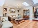 Comfortable living room showcasing tile flooring, skylight, and cozy seating at 5852 Medinah Way, Orlando, FL 32819