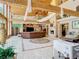 Expansive living room with fireplace, wood beams, and comfortable seating arrangements at 5852 Medinah Way, Orlando, FL 32819