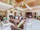 Open concept living room with fireplace, wood beams, and comfortable seating at 5852 Medinah Way, Orlando, FL 32819