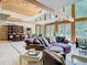 Large living room with vaulted ceilings, wooden beams, and comfortable seating area at 5852 Medinah Way, Orlando, FL 32819