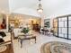 Spacious living room featuring neutral paint, tile flooring, and ample natural light at 5852 Medinah Way, Orlando, FL 32819