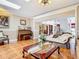 The living room features tile floors and a skylight for a bright and airy feel at 5852 Medinah Way, Orlando, FL 32819