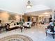 Open-concept living room with tile floors, high ceilings, and elegant furnishings at 5852 Medinah Way, Orlando, FL 32819