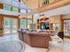 Spacious living room featuring high ceilings, wooden beams, and ample natural light at 5852 Medinah Way, Orlando, FL 32819