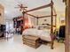 Well-appointed main bedroom featuring a canopy bed and built-in cabinets at 5852 Medinah Way, Orlando, FL 32819
