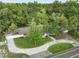 Aerial view of home showing the well manicured front lawn and stone paver driveway at 625 N Central Ave, Oviedo, FL 32765