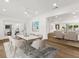 Elegant dining room with seating for six and seamless transition to living area at 625 N Central Ave, Oviedo, FL 32765