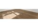 Close-up of the wood-look laminate flooring with sunlight shining through at 625 N Central Ave, Oviedo, FL 32765
