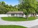 A charming one-story home boasts a well-manicured front yard and beautiful stone accents at 625 N Central Ave, Oviedo, FL 32765