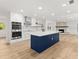 Bright kitchen with an island, stainless steel appliances, and an open floor plan at 625 N Central Ave, Oviedo, FL 32765