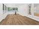 Bright living area with wood floors, white walls, and large sliding glass doors to the outside at 625 N Central Ave, Oviedo, FL 32765