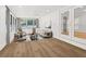 Cozy sunroom/living room with large windows, neutral tones, and modern furniture at 625 N Central Ave, Oviedo, FL 32765