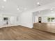 Open living space with wood flooring and entryways to other rooms at 625 N Central Ave, Oviedo, FL 32765