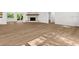 Open-concept design featuring hardwood floors, a fireplace and an open floorplan at 625 N Central Ave, Oviedo, FL 32765