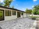 Back patio featuring stone pavers, and a fenced in yard at 625 N Central Ave, Oviedo, FL 32765