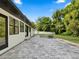 Back patio featuring stone pavers, and a fenced in yard at 625 N Central Ave, Oviedo, FL 32765