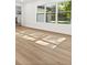 The room has wood-look flooring, bright white trim, white walls and large windows at 625 N Central Ave, Oviedo, FL 32765
