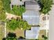 This aerial view showcases the roofline of the homes, their landscaping, and proximity to the street and parking at 657 Overspin Dr, Winter Park, FL 32789