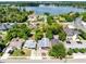 Stunning aerial view showcasing the property's neighborhood near a serene lake and lush green surroundings at 657 Overspin Dr, Winter Park, FL 32789