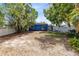 Spacious backyard featuring a fenced-in yard with partial shade and lush greenery, creating a serene and inviting outdoor space at 657 Overspin Dr, Winter Park, FL 32789