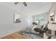 Comfortable bedroom with a large window, stylish decor, and a plush rug at 657 Overspin Dr, Winter Park, FL 32789