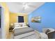 Bright bedroom boasts colorful walls, comfortable seating, and neutral furnishings, creating a cheerful and inviting space at 657 Overspin Dr, Winter Park, FL 32789
