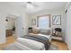 Bright bedroom features a comfortable bed, neutral decor, and stylish accents, creating a serene and inviting space at 657 Overspin Dr, Winter Park, FL 32789