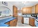 Traditional kitchen with blue countertops, ample cabinet space, and modern appliances at 657 Overspin Dr, Winter Park, FL 32789