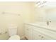 Well-lit bathroom featuring a bright mirror, tile floor, and a toilet at 662 Kenwick Cir # 102, Casselberry, FL 32707