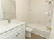 Modern bathroom with white vanity, sink, and updated shower and tub combo at 662 Kenwick Cir # 102, Casselberry, FL 32707
