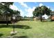 Expansive green space with mature trees and walking paths throughout the community at 662 Kenwick Cir # 102, Casselberry, FL 32707