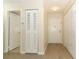 Bright hallway with modern flooring, closet, and doors, enhancing the welcoming ambiance at 662 Kenwick Cir # 102, Casselberry, FL 32707