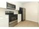 Contemporary kitchen showcasing stainless steel appliances, stylish cabinets, and sleek countertops at 662 Kenwick Cir # 102, Casselberry, FL 32707