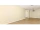 Spacious living room with light floors, perfect for gatherings and relaxation at 662 Kenwick Cir # 102, Casselberry, FL 32707