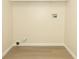 Empty room featuring laundry hook ups and neutral walls and trim at 662 Kenwick Cir # 102, Casselberry, FL 32707