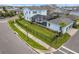 Aerial view of a two-story blue house with a screened pool, fenced yard, and two car garage at 6875 Bridgman St, Orlando, FL 32827