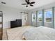 Serene bedroom featuring ample natural light, a ceiling fan, and a stylish rug for comfort and relaxation at 6875 Bridgman St, Orlando, FL 32827