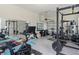 Spacious home gym featuring modern equipment, mirrors, and ample space for a complete workout experience at 6875 Bridgman St, Orlando, FL 32827