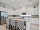 Bright, modern kitchen featuring stainless steel appliances, granite countertops, and a spacious center island at 6875 Bridgman St, Orlando, FL 32827