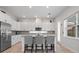 Bright, modern kitchen featuring stainless steel appliances, granite countertops, and a spacious center island at 6875 Bridgman St, Orlando, FL 32827