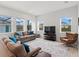 Bright living room with hardwood floors, modern furnishings, and large windows providing lots of natural light at 6875 Bridgman St, Orlando, FL 32827