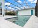 Sparkling swimming pool with a screened enclosure, offering a refreshing oasis in a private backyard setting at 6875 Bridgman St, Orlando, FL 32827