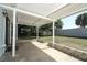 Backyard featuring a covered patio, storage shed and a lawn at 707 N Solandra Dr, Orlando, FL 32807