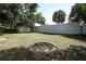 Backyard featuring a lawn, a shed, and a fire pit at 707 N Solandra Dr, Orlando, FL 32807