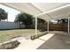 Backyard featuring a large brick patio and a grass lawn at 707 N Solandra Dr, Orlando, FL 32807