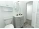 Bathroom showcasing a modern vanity, mirror, and toilet at 707 N Solandra Dr, Orlando, FL 32807
