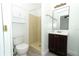 Bright bathroom featuring a toilet, vanity, and shower with modern fixtures and finishes at 707 N Solandra Dr, Orlando, FL 32807