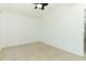 Bedroom with white walls and tile flooring, creating a bright and simple space at 707 N Solandra Dr, Orlando, FL 32807
